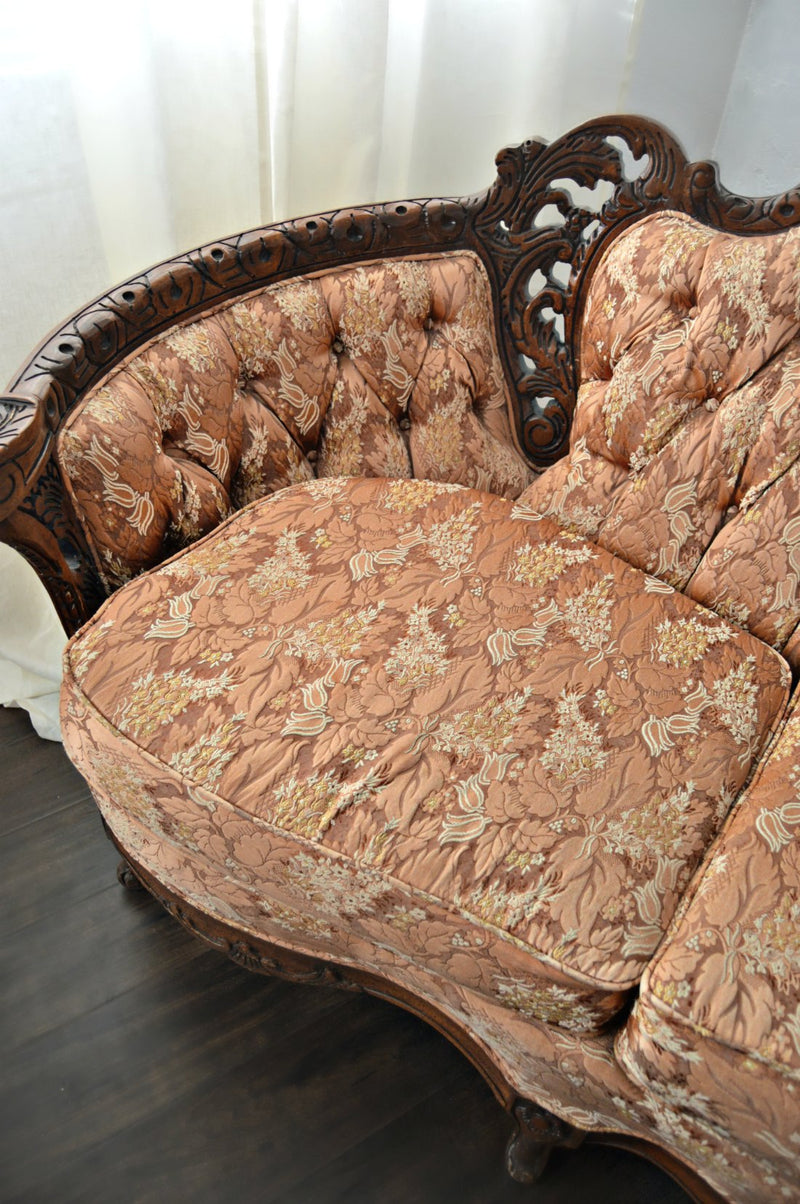 Fabric of rust colored Victorian sofa