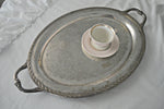 Ornate silver vintage serving tray with tea cup