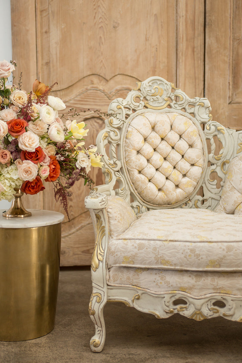 Rococo details on cream and gold vintage settee