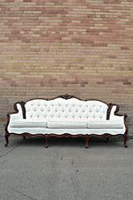 Elegant ivory vintage sofa