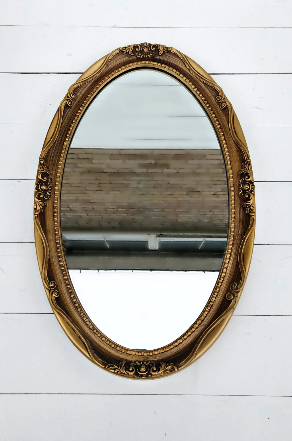 Oval vintage gold mirror