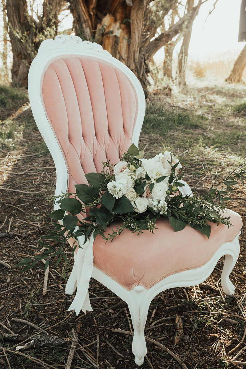 Pink velvet wing-back chairs