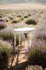 Ivory and gold vintage table in lavender field