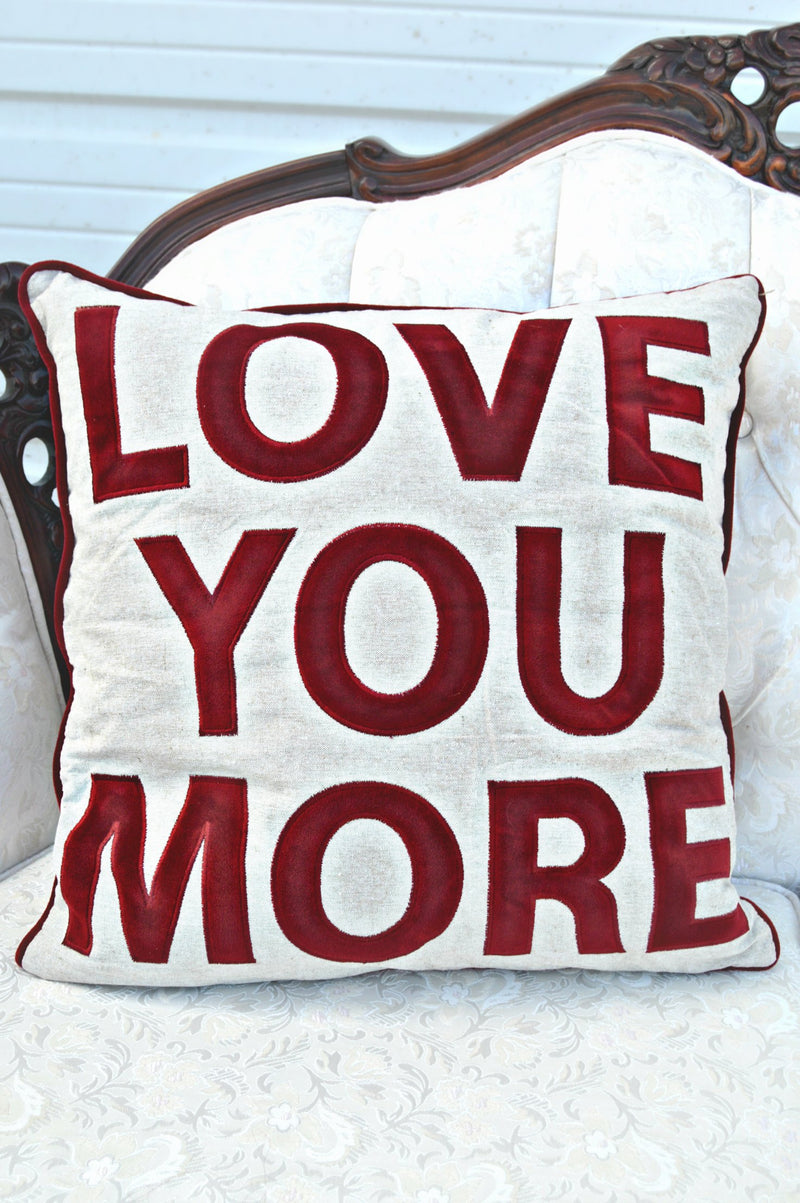 Love you more pillow with red letters