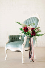 Blue velvet wing back chair with florals