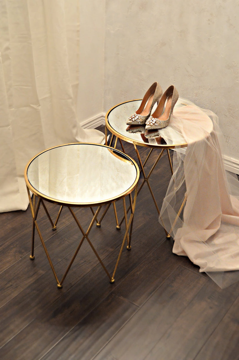 Gold mirror nesting tables