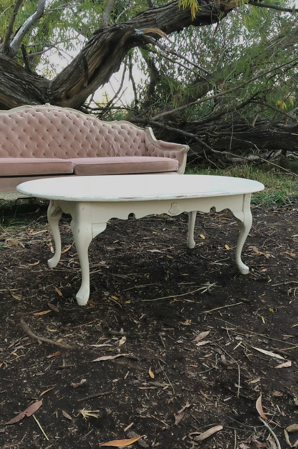 Cream coffee table with pink sofa
