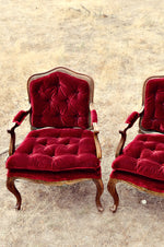 Red velvet tufted chairs