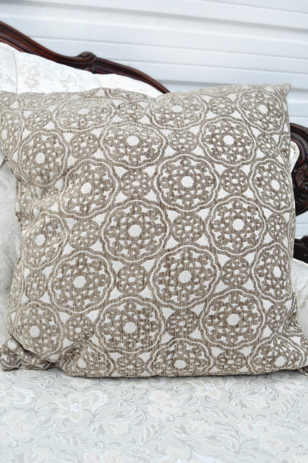 Tan kaleidoscope patterned pillow