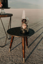 Modern bronze table in desert photoshoot