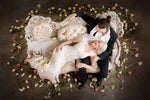 Bride and Groom lounging on beautiful Victorian settee