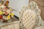 Tufts on cream and gold vintage settee