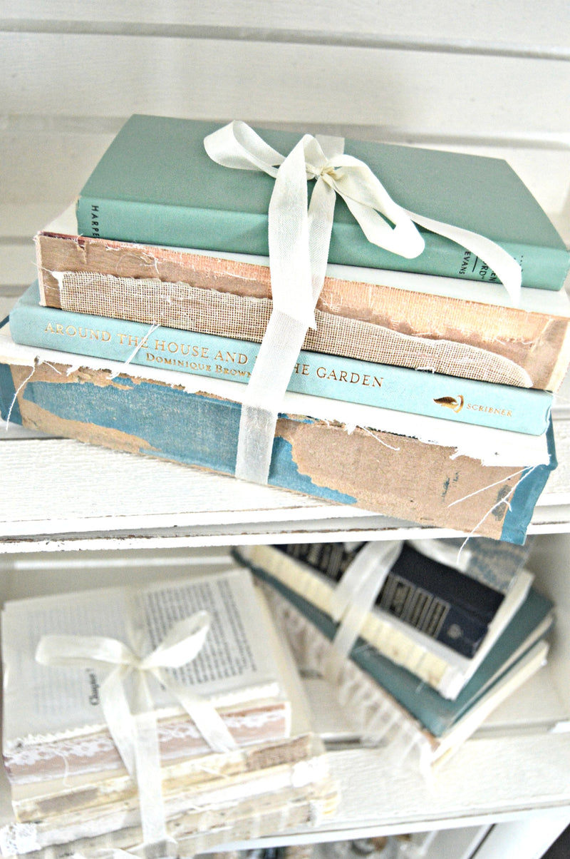 Blue vintage books bundled together for wedding centerpieces