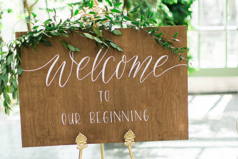 "Welcome to our Beginning" wooden wedding sign