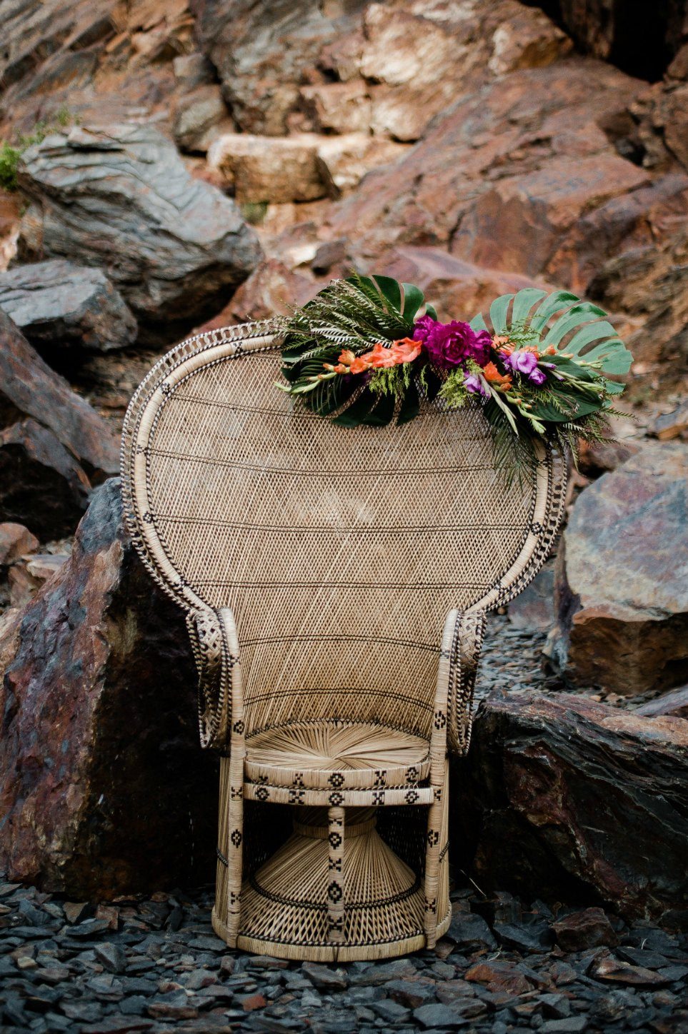 Peacock chair with floral decor in mountains