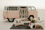 VW bus with macrame and bohemian decor in the desert