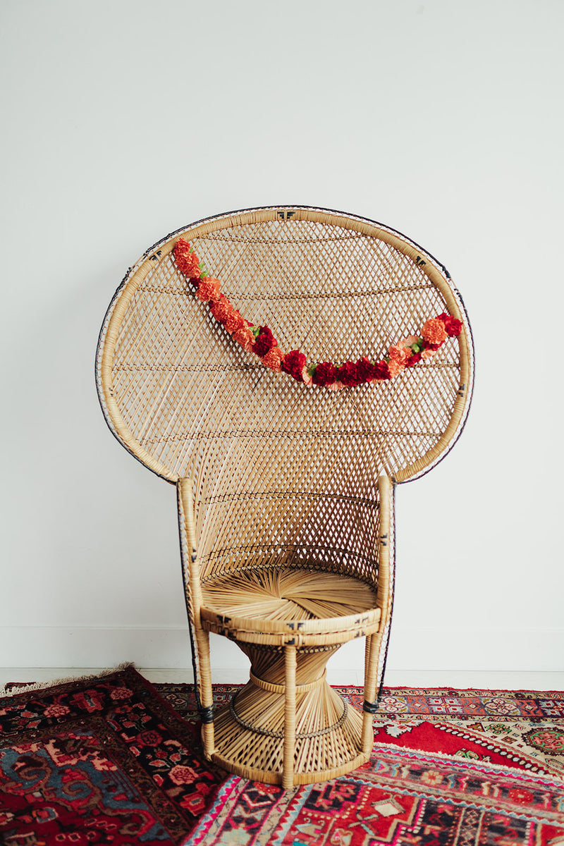 Peacock chair with floral decor