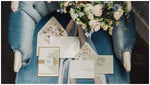 Wedding invitation suite on blue velvet chair